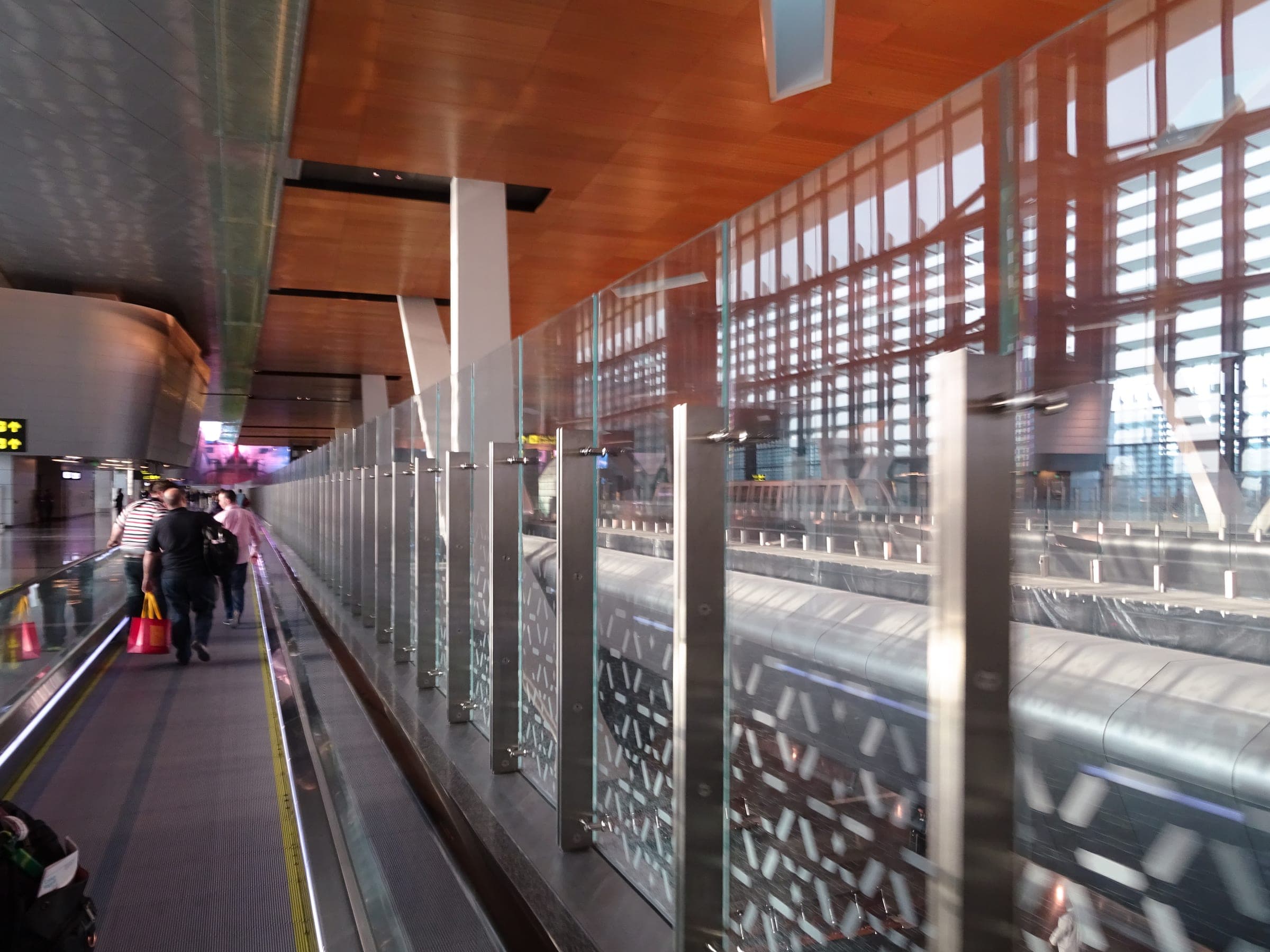 The long travelator towards arrivals inside Hamad International Airport, Doha.